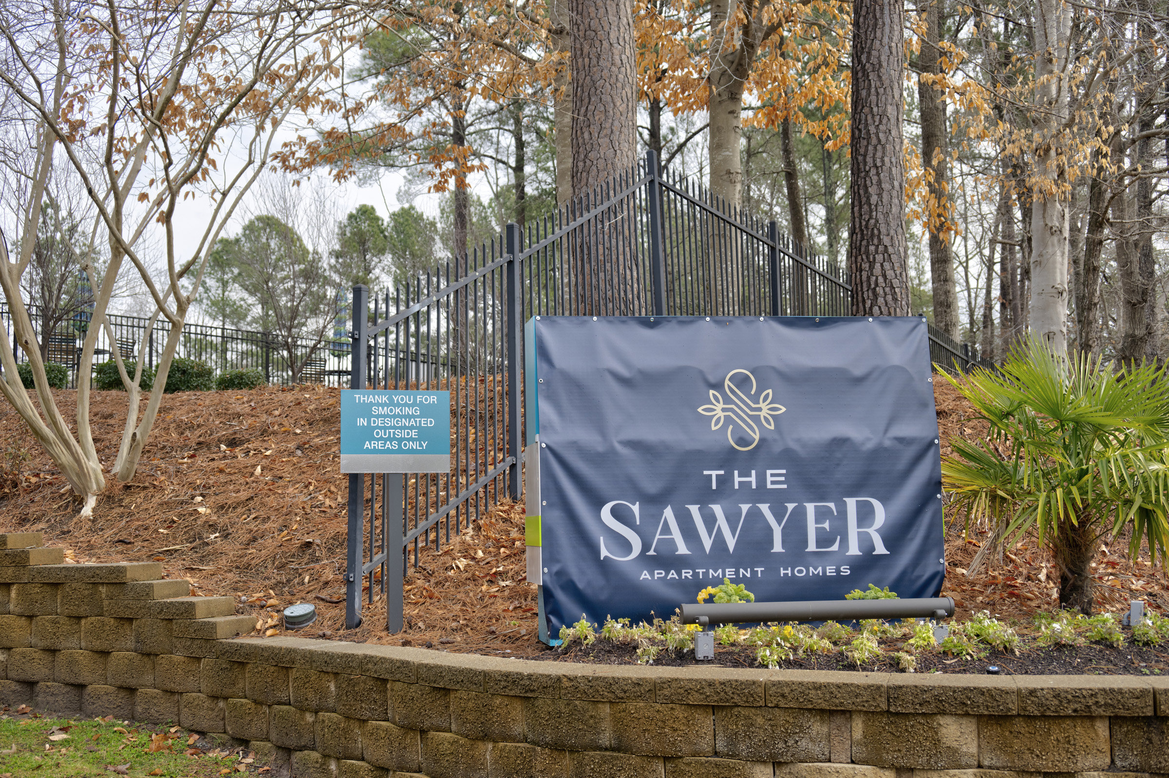 the sawyer sign in front of a wooded area at The  Sawyer