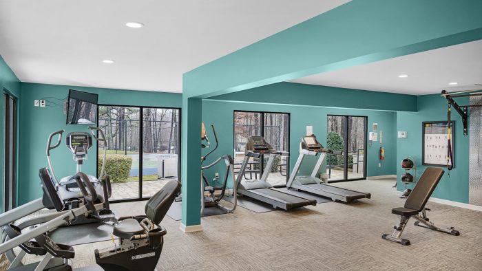 a gym room with a treadmill and exercise equipment at The  Sawyer