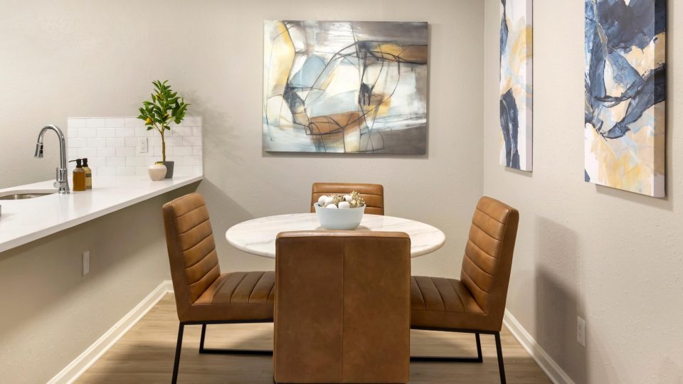 a dining room with a table and chairs at The Sawyer