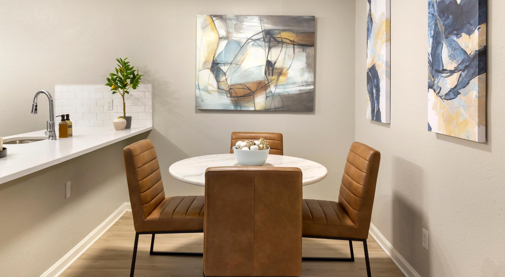 a dining room with a table and chairs at The Sawyer