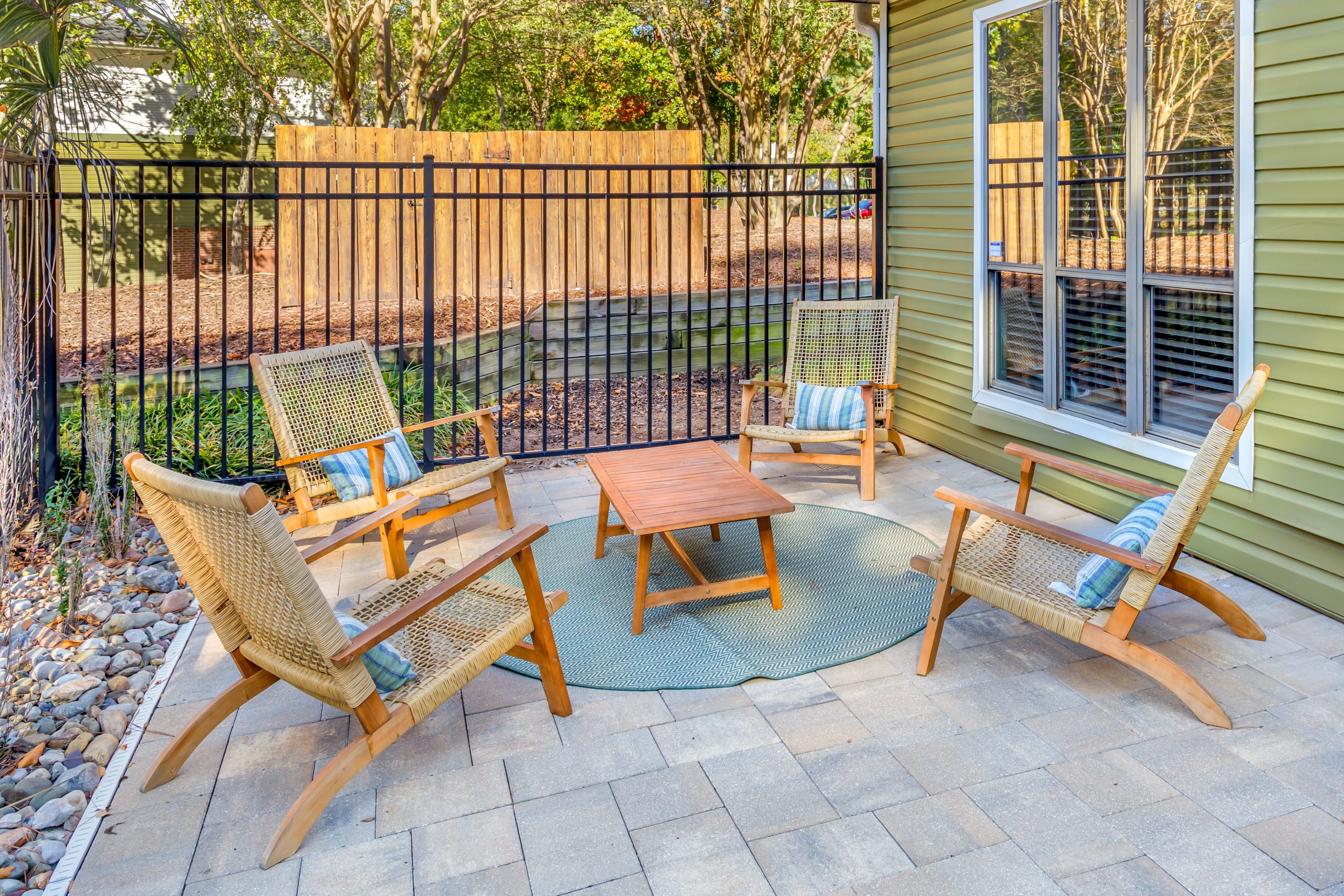 patio with chairs and table in front of fence at The  Sawyer