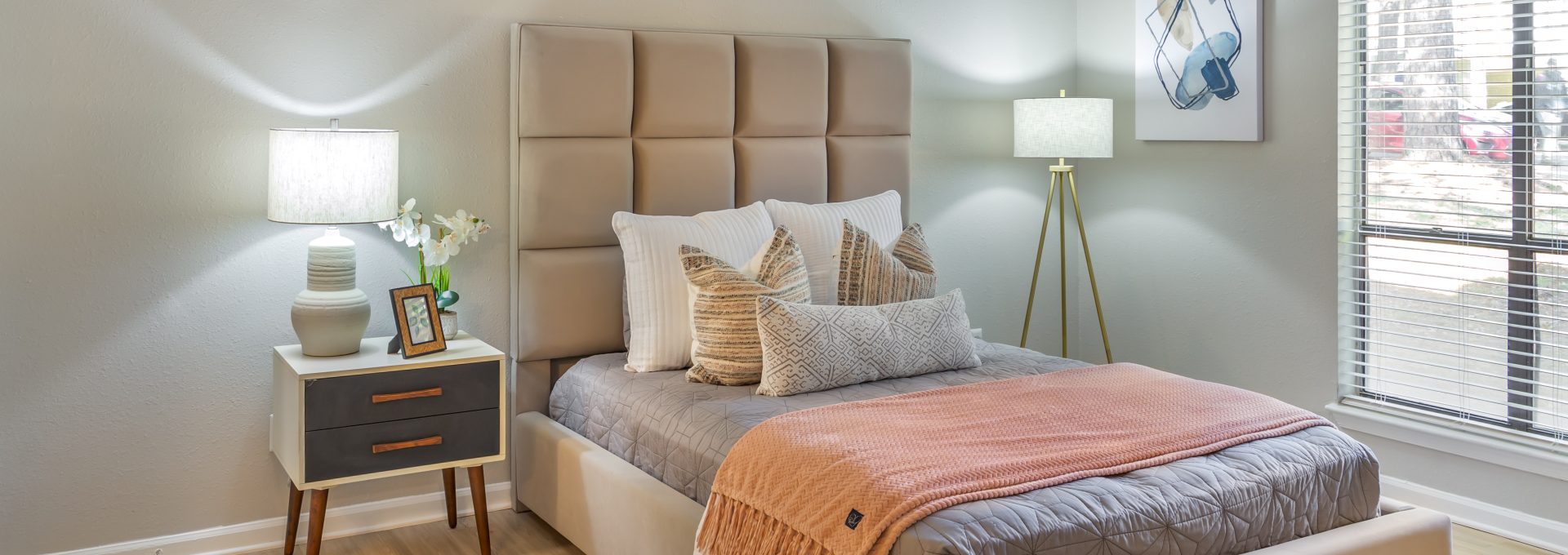 a bedroom with a bed, nightstands and a lamp at The  Sawyer