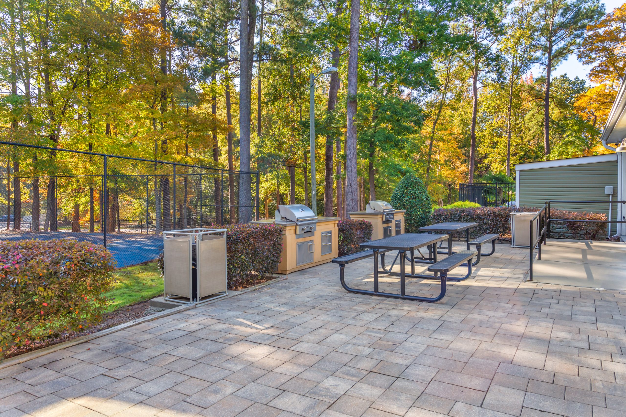 patio with picnic tables and grill at The  Sawyer